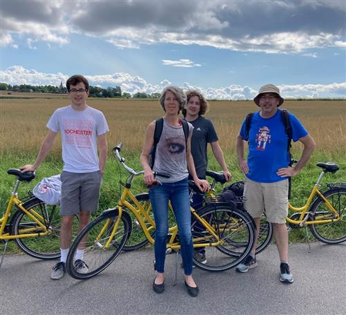 Mr. Young & family posed with bikes on a country road.